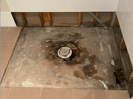 Professional preparation work for shower leak repair without tile removal